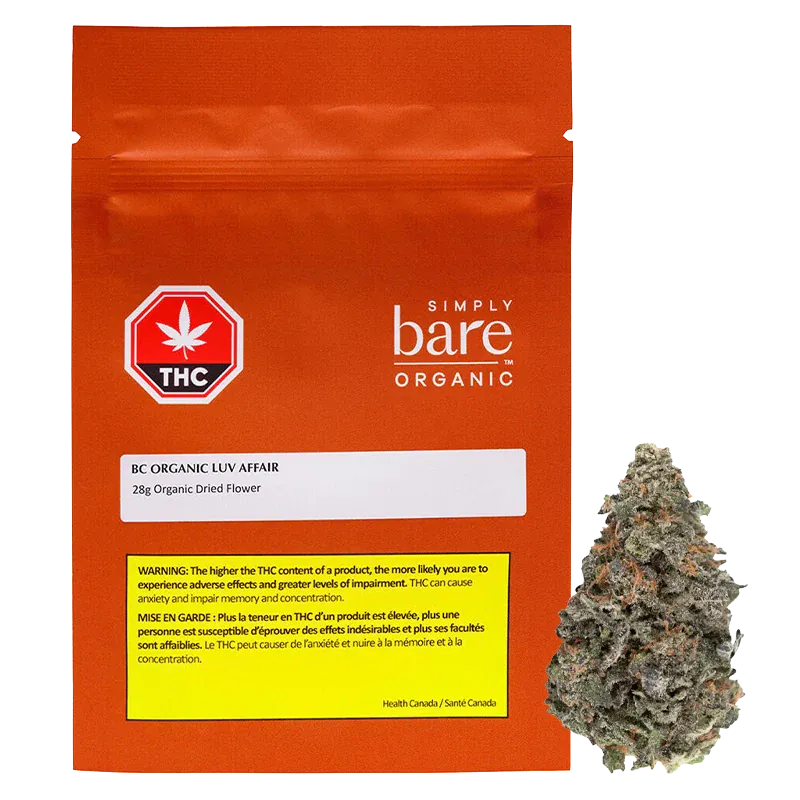 Front-facing shot of the orange pouch and adjacent bud, labeled "BC Organic Luv Affair" with the pouch's white logo and THC warning visible.