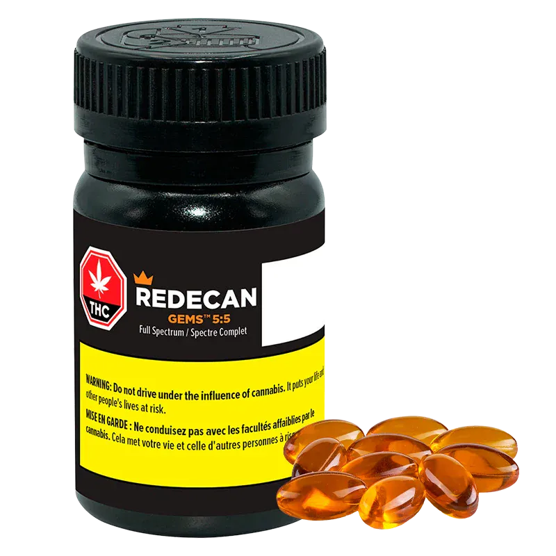 Front view of a black bottle labeled Redecan Gems 5:5 Capsules with a yellow warning panel and amber softgel capsules arranged at its base.