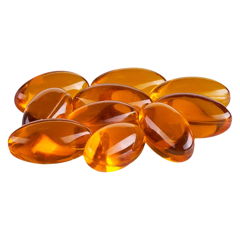 Close-up of glossy amber softgel capsules arranged in a small pile, Gems 5:5 Capsules.