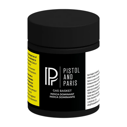 Front three-quarter view of the black Pistol and Paris Gas Basket jar with bold white logo and yellow warning panel.
