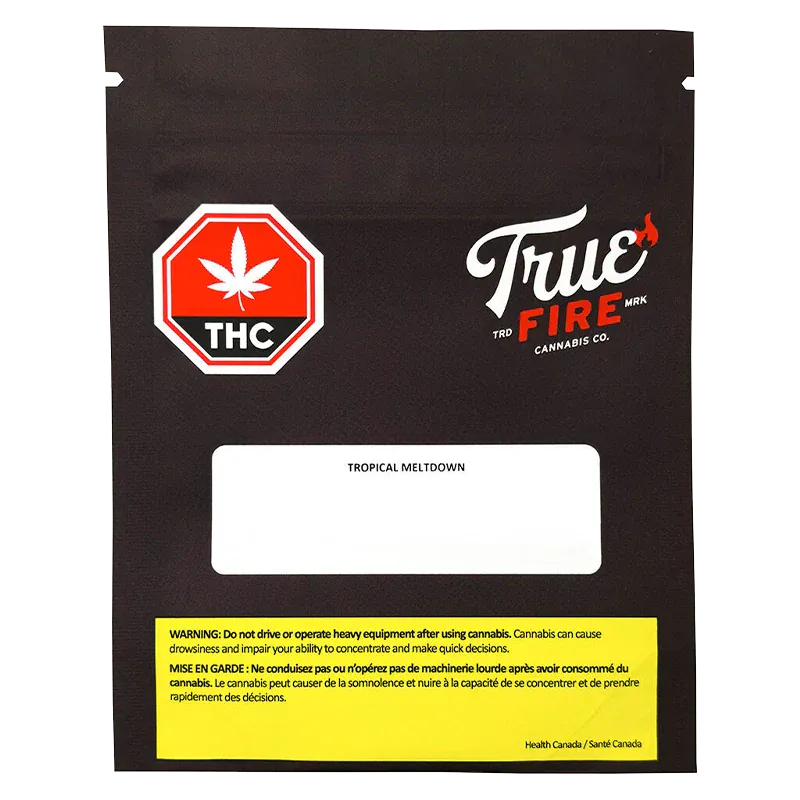 Front-facing image of the black True Fire Tropical Meltdown bag with a red THC stop-sign logo, white label area, and yellow warning box.