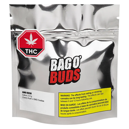 Front view of the metallic pouch labeled BAGO' BUDS containing GMO Kush with a red THC stop sign logo and yellow warning box.