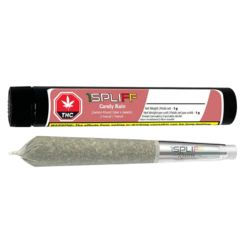 Horizontal product shot of a rolled joint and black tube packaging labeled "Candy Rain Premium Glass Tip PR 1 x 1 g" laid against a white background.