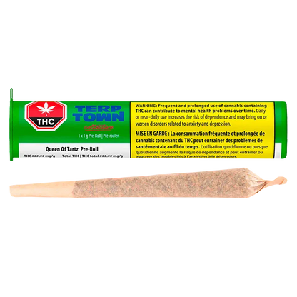 Horizontal close-up of a pre-rolled joint in front of a green tube package labeled Queen of Tartz PR 1 x 1 g.
