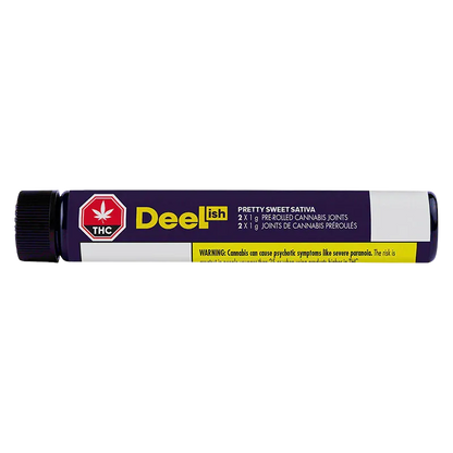 Horizontal close-up of a purple tube labeled Deelish Pretty Sweet PR 2 x 1 g with a black cap and yellow warning strip.
