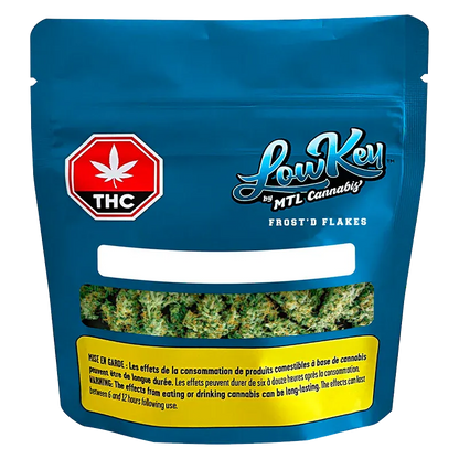 Front-facing blue pouch of Frost'd Flakes by LowKey showing a window of green cannabis buds and a red THC symbol.
