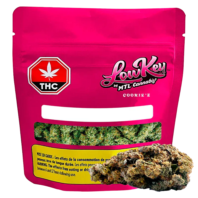 Front-facing pouch shot of the bright pink Cookie'z package by LowKey with a clear window showing green buds and a THC symbol.
