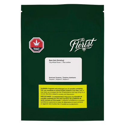 Front view of the dark green Rare Cuts pouch with white "The Florist" logo, THC symbol, and product label and warning blocks.
