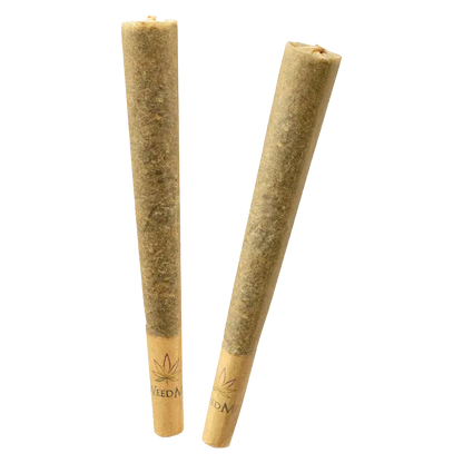 Two angled Pink Kush PR 2 x 1 g pre-rolls standing on a white background with visible leaf-logo paper tips.
