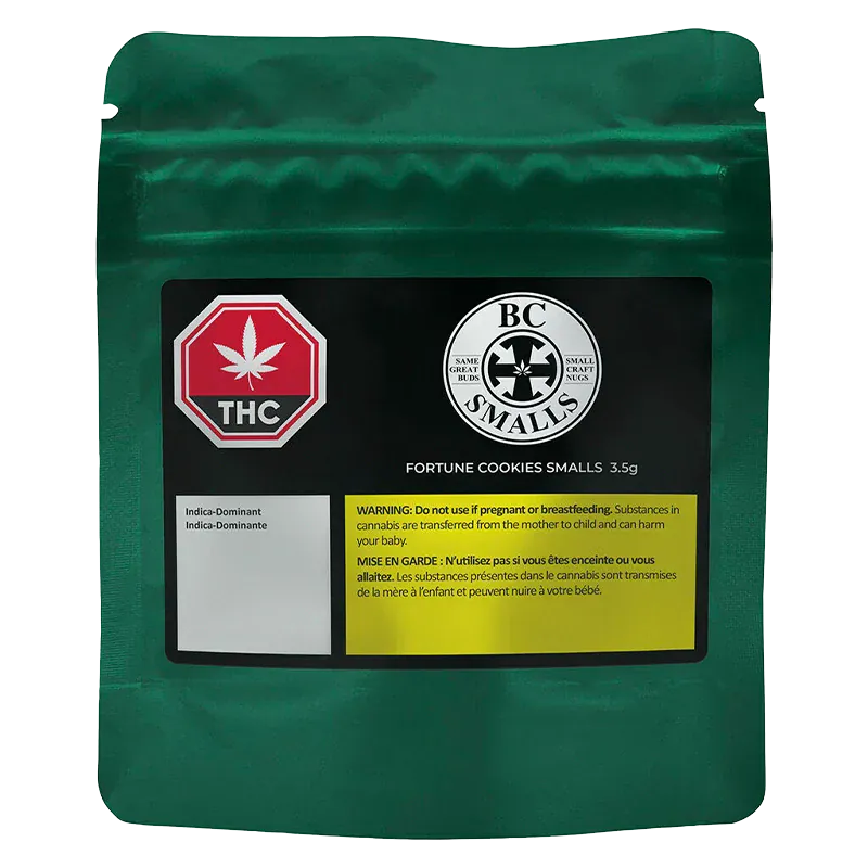 Front-facing shot of a metallic green pouch labeled "Fortune Cookies Smalls" with a black product panel, THC symbol, BC Smalls logo, and a yellow warning box.