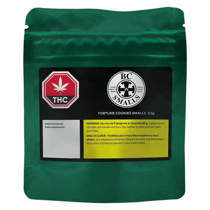 Front-facing shot of a metallic green pouch labeled "Fortune Cookies Smalls" with a black product panel, THC symbol, BC Smalls logo, and a yellow warning box.