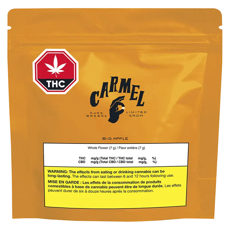 Front-facing shot of the orange Carmel Big Apple pouch with a red THC stop-sign logo and a white nutrition label near the bottom.