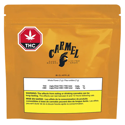 Front-facing shot of the orange Carmel Big Apple pouch with a red THC stop-sign logo and a white nutrition label near the bottom.