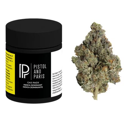 Three-quarter front view of a black Pistol and Paris Gas Pack jar beside a frosty green cannabis bud on a white background