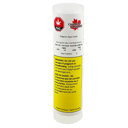 Front-facing shot of the cylindrical white container labeled "Organic Apex Kush PR 10 x 0.5 g" with a red THC maple logo and a large yellow health warning panel.