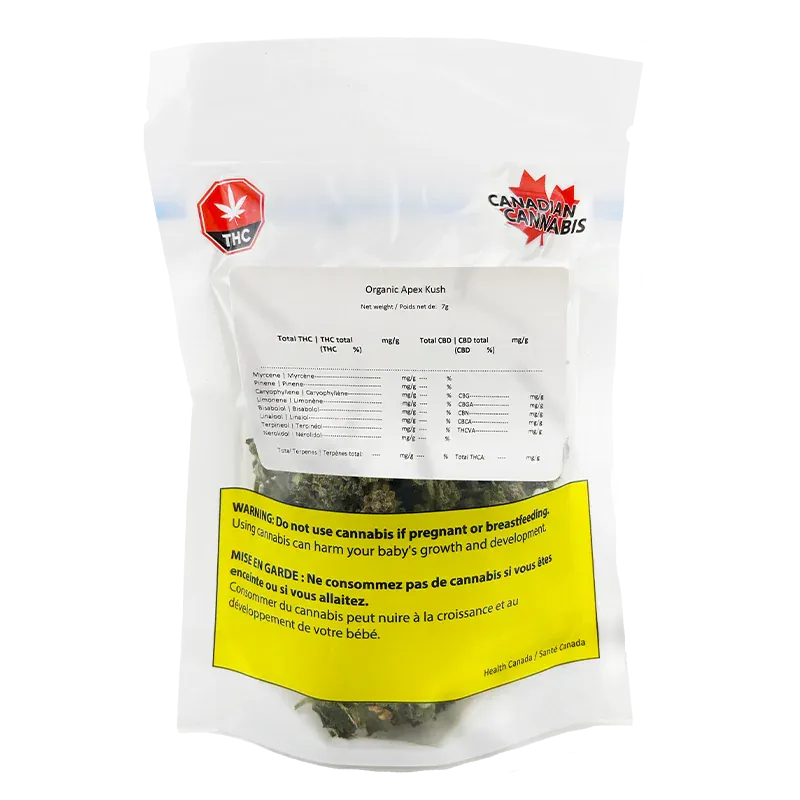 Front-facing shot of a clear pouch labeled Organic Apex Kush showing dried buds through the window, white label details, and a yellow health warning.