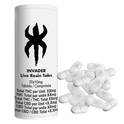 Front-facing white Invader Live Rosin Tabs bottle with black logo beside a scattered pile of oval white tablets.