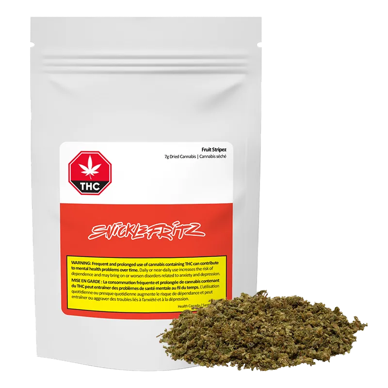 Front-facing shot of a white and red pouch labeled Fruit Stripez with loose green-brown cannabis piled in front.
