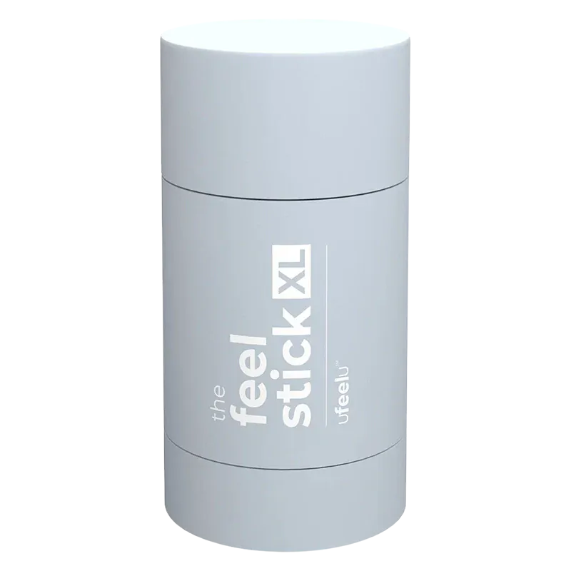 Top-down view of the pale blue cylindrical The Feel Stick XL with white vertical branding visible on its curved surface