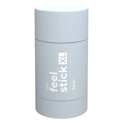 Top-down view of the pale blue cylindrical The Feel Stick XL with white vertical branding visible on its curved surface
