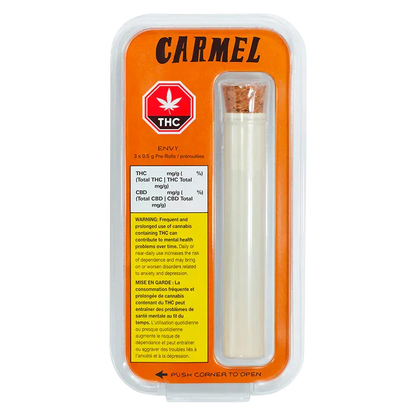 Top-down studio shot of the Carmel Envy PR 3 x 0.5 g blister pack showing an orange backing, THC symbol, and a cork-sealed tube.