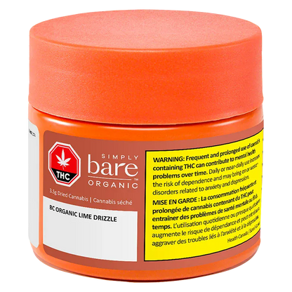 Three-quarter front view of the orange jar labeled Simply bare Organic BC Organic Lime Drizzle with a large yellow THC warning panel.