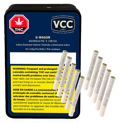 Top-down view of a navy tin labeled VCC G-Wagon PR 10 x 0.5 g with ten rolled pre-rolls fanned beside it.