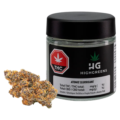 Front-angle shot of a 3.5 g HighGreens Atomic Slurricane jar with black lid and label, shown alongside a single frosty orange-tinted bud.