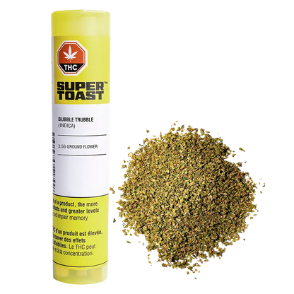 Tall yellow tube of Pop n' Pour Bubble Trubble shown upright beside a loose mound of finely ground green flower on a white background