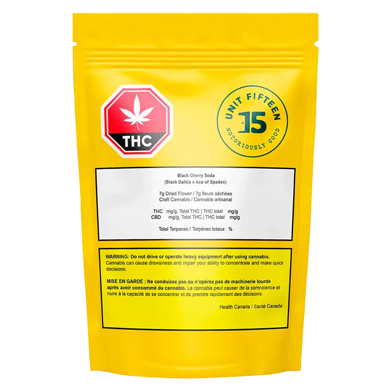 Rear view of the yellow pouch showing the Unit Fifteen U15 Black Cherry Soda Sativa 7 g - Unit 15 logo, THC stop sign, and warning labels.