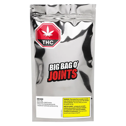 Front-facing shot of a reflective silver pouch labeled "BIG BAG O' JOINTS" with a red THC badge and the product name GMO Kush PR 70 x 0.4 g visible on the lower label.