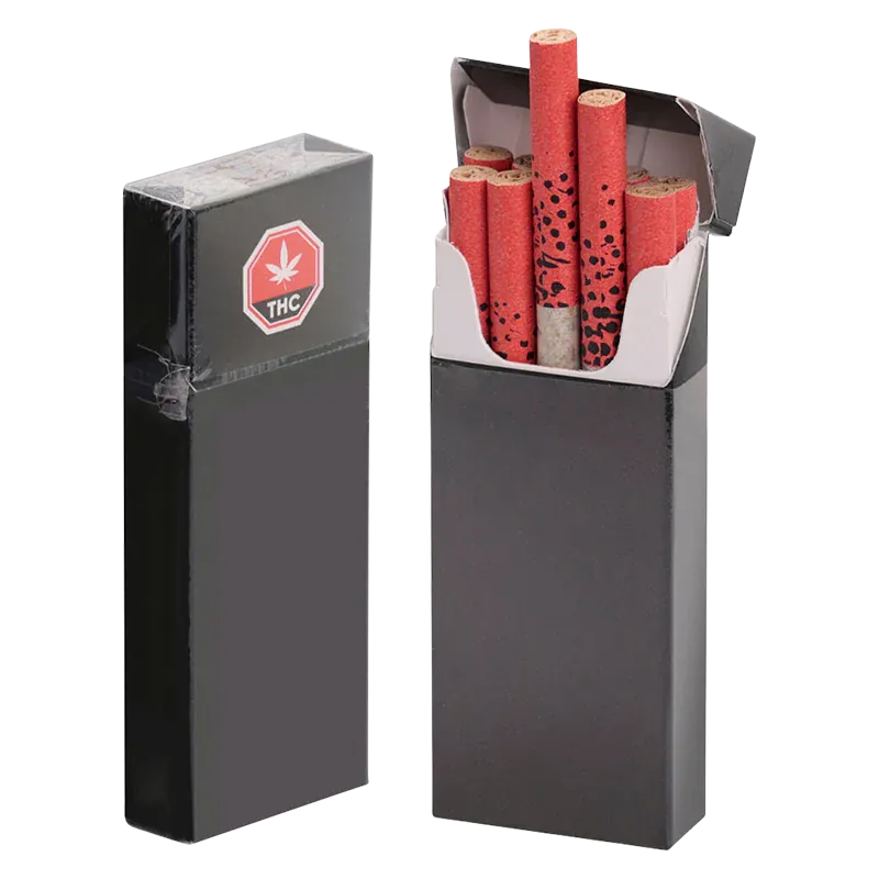 Front-facing shot of an open black pack of GMO Kush PR 70 x 0.4 g showing red patterned filter tips neatly arranged inside and a sealed spare pack beside it