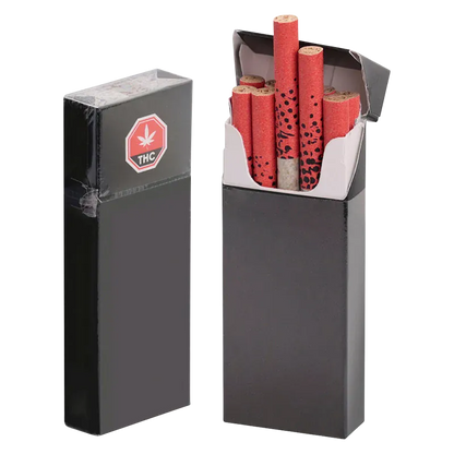 Front-facing shot of an open black pack of GMO Kush PR 70 x 0.4 g showing red patterned filter tips neatly arranged inside and a sealed spare pack beside it
