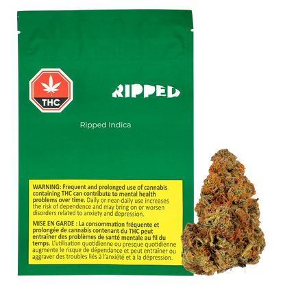 Front view of the green pouch and adjacent bud labeled Ripped Indica showing a THC warning panel and a close-up of the 28 g nug.