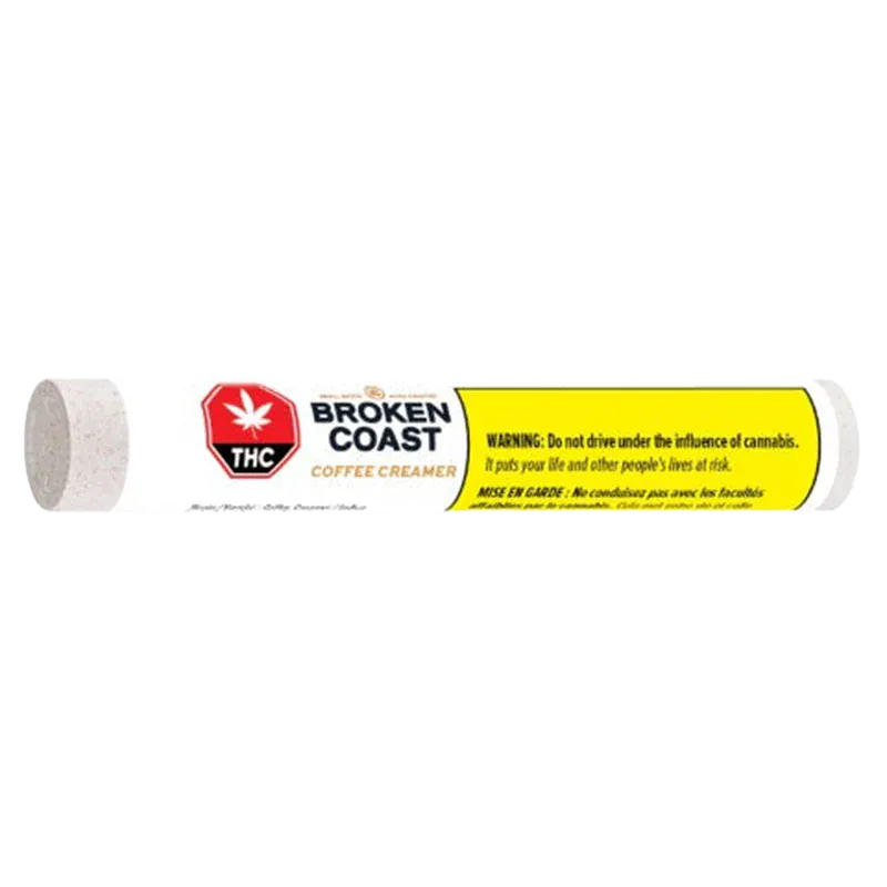 Side view of a white tube labeled Broken Coast Coffee Creamer Blunt PR 1 x 1 g with a red THC symbol and yellow warning panel.