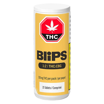 Front-facing image of a yellow-tinted Blips 1:2 THC:CBG Tablets container with bold logo, THC symbol, and dosage text visible.