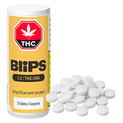 Three-quarter view of a yellow Blips 1:2 THC:CBG Tablets bottle standing next to a scattered pile of white round tablets on a white background