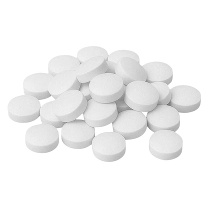 Top-down view of a scattered pile of white tablets labeled 1:2 THC:CBG Tablets.