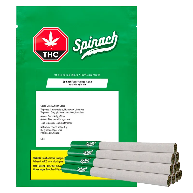 Front-facing green package with a red THC octagon and "Spinach" logo, the "STIX Space Cake PR 10 x 0.4 g" bag shown with a stack of green‑tipped pre-rolls at the lower right.