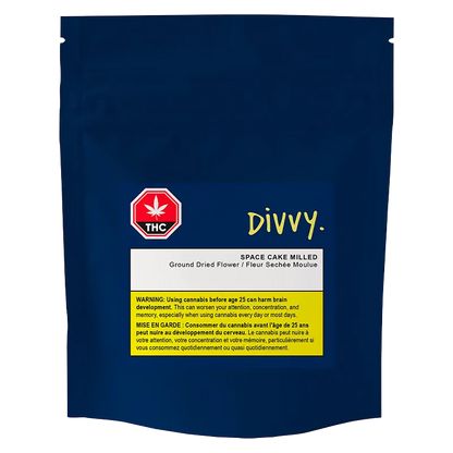 Front-facing shot of the navy resealable pouch labeled "Divvy. Space Cake Milled" with THC symbol and yellow warning box near the bottom