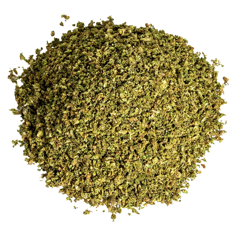 Top-down view of a loose green herb pile labeled Space Cake Milled.