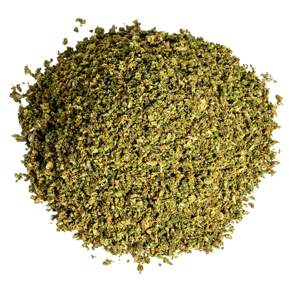 Top-down view of a loose green herb pile labeled Space Cake Milled.