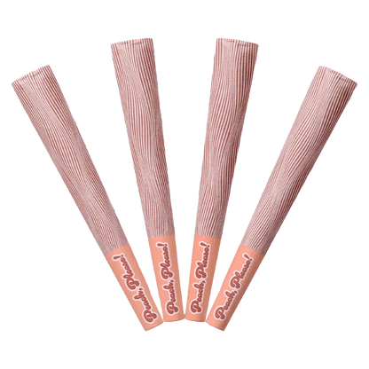 Top-down view of four peach-toned Peach Please PR 4 x 0.5 g sticks fanned out with striped wrappers and branded caps.