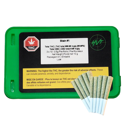 Top-down view of a green plastic tin labeled Dual Pre PR 20 x 0.5 g with a black label and a fan of seven pre-rolls resting beside it.