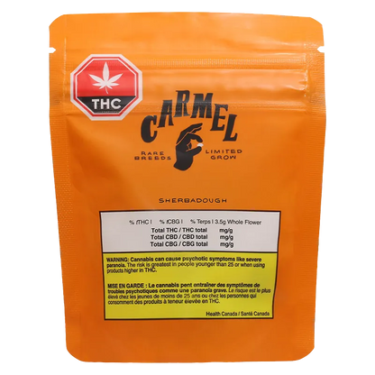 Front-facing shot of the orange Carmel Sherbadough pouch with its THC symbol, black logo and labeled warning panel.