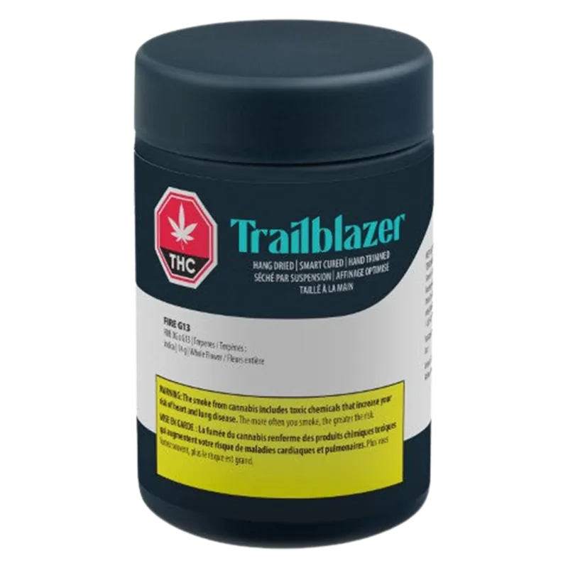 Front view of the Trailblazer Fire G13 black cylindrical container with teal logo and a yellow warning label.