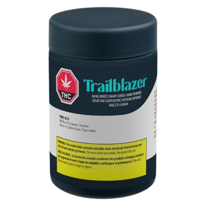 Front view of the Trailblazer Fire G13 black cylindrical container with teal logo and a yellow warning label.