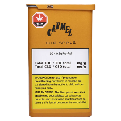 Front view of the mustard-yellow tin labeled Big Apple PR 10 x 0.5 g with "Carmel" logo and a white info panel and warning block.