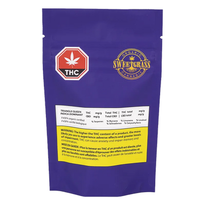 Rear view of the purple SweetGrass Triangle Queen Petites pouch showing THC warning labels and the brand logo centered near the top