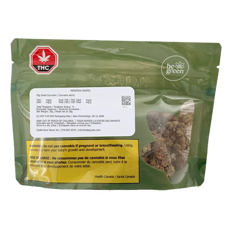 Front view of the green bc green Modified Grapes pouch with a clear window showing dried cannabis buds and warning labels.